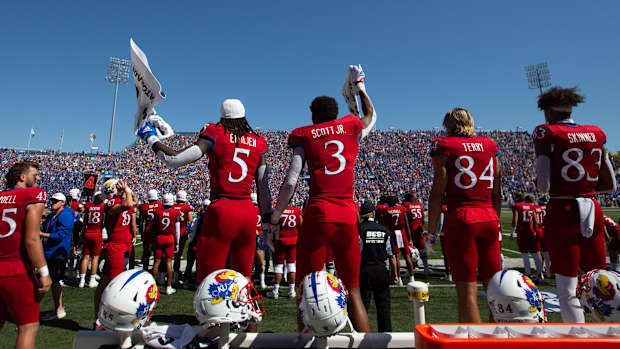 The Kansas bench yells out and cheers as the final seconds of Saturday's game against Duke winds down at David Booth Kansas Memorial Stadium.